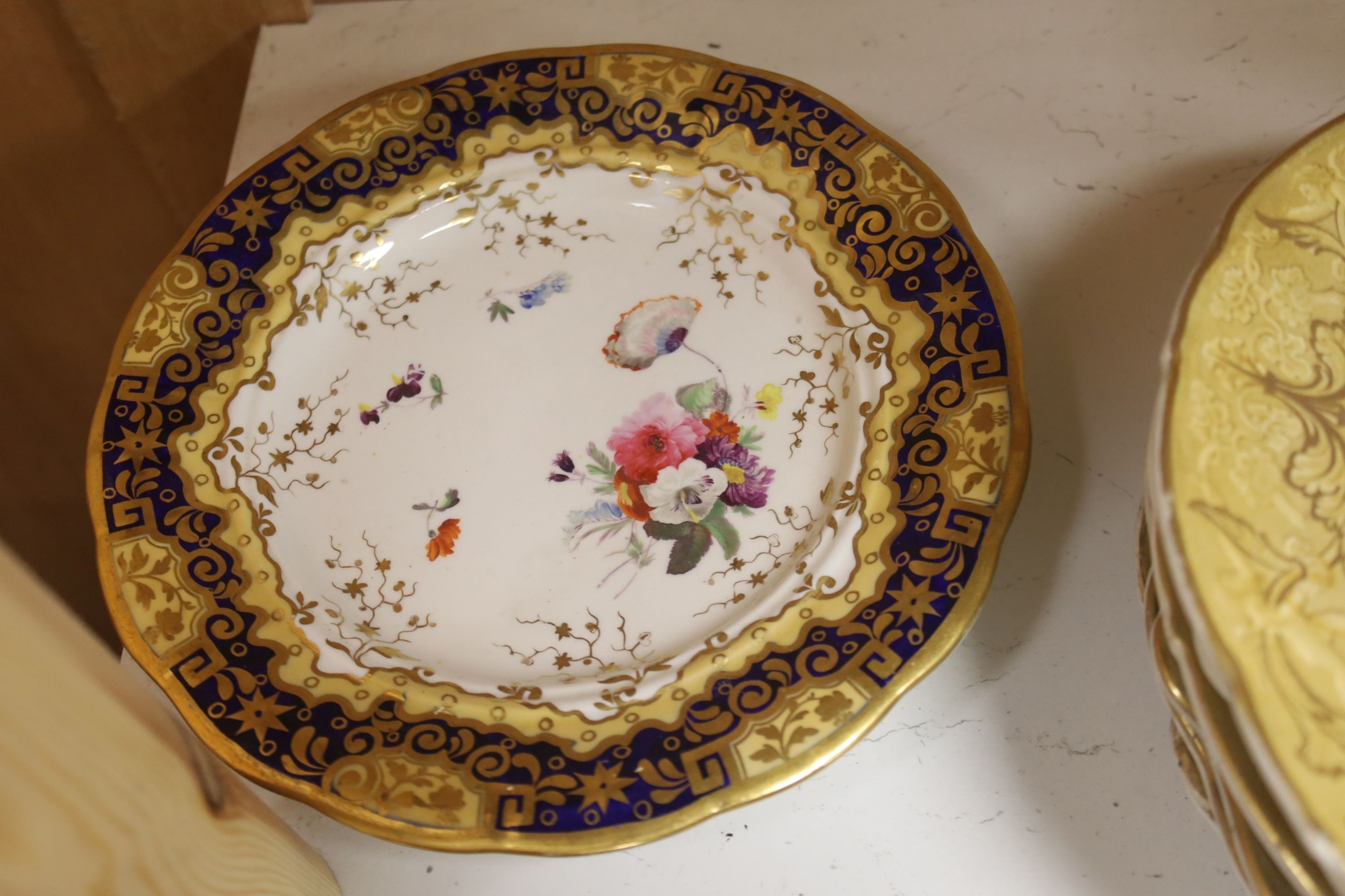 A collection of eight F & R Pratt landscape plates and six 19th-century porcelain plates